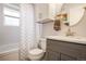 Clean bathroom with shower-tub combo and classic fixtures at 7949 W Portland Ave, Littleton, CO 80128