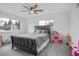 Cozy bedroom with ample natural light and a ceiling fan at 7949 W Portland Ave, Littleton, CO 80128