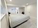 Bedroom featuring neutral colored walls, gray carpet, and a bed with lots of natural light at 7949 W Portland Ave, Littleton, CO 80128