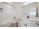 Stylish bathroom featuring a shower and tub combo, complemented by sleek finishes at 1243 Rhett Dr, Erie, CO 80026
