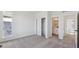 Cozy bedroom leading to a bathroom and closet with ample storage space at 1243 Rhett Dr, Erie, CO 80026