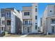 Contemporary three-story home boasting modern design and a welcoming entrance at 1243 Rhett Dr, Erie, CO 80026