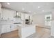 Modern kitchen with stainless steel appliances and a stylish island at 1243 Rhett Dr, Erie, CO 80026