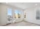 Bright living space features a door to a balcony with great neighborhood views at 1243 Rhett Dr, Erie, CO 80026