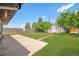 Spacious backyard with a storage shed, lawn, and concrete patio, perfect for outdoor living at 3640 Forest St, Denver, CO 80207