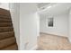 Basement with stairs leading down into a room with carpet at 3640 Forest St, Denver, CO 80207