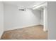 Finished basement space with neutral carpet, white walls, and a small window for natural light at 3640 Forest St, Denver, CO 80207