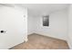 Finished basement with carpeting and a small window at 3640 Forest St, Denver, CO 80207