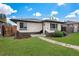 Charming single-story home with a well-manicured lawn and inviting walkway to the front door at 3640 Forest St, Denver, CO 80207
