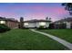 Charming single-story home with a well-manicured lawn and inviting walkway to the front door at 3640 Forest St, Denver, CO 80207