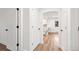 Hallway with new wood floors, modern lighting, and white trim at 3640 Forest St, Denver, CO 80207