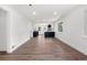Unfurnished living room showcasing the new hardwood flooring and open layout connecting to the kitchen at 3640 Forest St, Denver, CO 80207