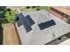 Close-up aerial view of a roof with solar panels, showcasing energy efficiency and modern technology at 3640 Forest St, Denver, CO 80207