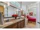 Bathroom featuring double sinks, granite countertops, and access to the main bedroom at 6948 W Jewell Dr, Lakewood, CO 80227