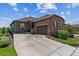 Charming single-Gathering home with a stone facade and inviting two-car attached garage at 6948 W Jewell Dr, Lakewood, CO 80227