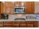 Modern kitchen with stainless steel appliances, granite countertops and plenty of storage at 6948 W Jewell Dr, Lakewood, CO 80227