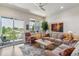 Comfortable living room with plush seating, natural light, and scenic outdoor views at 6948 W Jewell Dr, Lakewood, CO 80227