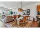 Bright living room with neutral decor, large windows, and an adjacent outdoor balcony at 6948 W Jewell Dr, Lakewood, CO 80227