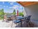Comfortable patio space featuring a table and chairs for outdoor dining and entertaining at 6948 W Jewell Dr, Lakewood, CO 80227