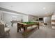 Spacious finished basement featuring a pool table, neutral decor, and ample room for recreation and relaxation at 17054 Hop Clover Ave, Parker, CO 80134