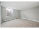 Finished basement bedroom featuring a large window, neutral decor, and plenty of potential at 17054 Hop Clover Ave, Parker, CO 80134