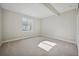 Finished basement bedroom featuring a large window, neutral decor, and ample room for customization at 17054 Hop Clover Ave, Parker, CO 80134
