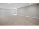 Open basement area with plush carpet and neutral walls at 17054 Hop Clover Ave, Parker, CO 80134