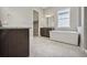 Primary bathroom with a soaking tub, double vanity, granite countertop, and walk-in closet at 17054 Hop Clover Ave, Parker, CO 80134
