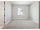 This bedroom boasts neutral walls and carpet, window, and a closet at 17054 Hop Clover Ave, Parker, CO 80134