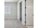 Bedroom featuring closet with sliding doors, plush carpet and a window at 17054 Hop Clover Ave, Parker, CO 80134