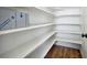 Walk-in pantry with multiple shelves for optimal kitchen storage and organization at 17054 Hop Clover Ave, Parker, CO 80134
