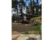 View of exterior elevation of cabin-style home with stairs leading to a deck at 27447 Upper Cold Spg Gulch Rd, Golden, CO 80401