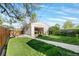 Large backyard with green grass and modern outbuilding at 1474 S Emerson St, Denver, CO 80210