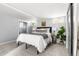 Basement bedroom with a queen bed, gray carpet, and natural lighting at 1474 S Emerson St, Denver, CO 80210