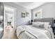 Spacious bedroom with modern decor, plenty of natural light, and hardwood floors at 1474 S Emerson St, Denver, CO 80210