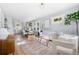 Open floor plan showcasing the kitchen, dining area, and sun-filled living room at 1474 S Emerson St, Denver, CO 80210