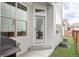 Backyard patio with dining and lounge seating and privacy fence at 10384 E 60Th Pl, Denver, CO 80238