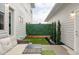 Private backyard with stylish outdoor furniture and evergreen landscaping at 10384 E 60Th Pl, Denver, CO 80238