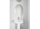 Pedestal sink in an elegant bathroom at 10384 E 60Th Pl, Denver, CO 80238