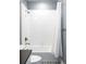 Full bathroom with tub-shower combo and decorative tile flooring at 10384 E 60Th Pl, Denver, CO 80238