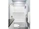 Clean bathroom with a white subway tile shower and patterned floor at 10384 E 60Th Pl, Denver, CO 80238