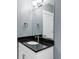 Modern bathroom features a granite countertop and undermount sink at 10384 E 60Th Pl, Denver, CO 80238