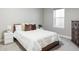 Cozy bedroom featuring a comfortable bed, neutral tones, and ample natural light at 10384 E 60Th Pl, Denver, CO 80238