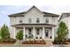 Charming two-story home with a well-maintained front yard and inviting front porch at 10384 E 60Th Pl, Denver, CO 80238