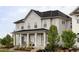 Charming home features a welcoming front porch and landscaped yard at 10384 E 60Th Pl, Denver, CO 80238