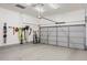 Clean and organized garage featuring durable epoxy flooring and ample storage for tools and equipment at 10384 E 60Th Pl, Denver, CO 80238