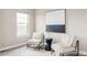 Cozy sitting area with neutral-toned chairs and an abstract art piece at 10384 E 60Th Pl, Denver, CO 80238