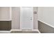 Hallway entrance showing unit door and number with neutral-colored walls, carpet, and dark trim at 9079 E Panorama Cir # 520, Englewood, CO 80112