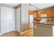 Kitchen with granite countertops, stainless appliances, and light wood cabinets is shown from dining area at 9079 E Panorama Cir # 520, Englewood, CO 80112