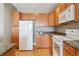 Bright kitchen showcases sleek white appliances and rich granite countertops at 9079 E Panorama Cir # 520, Englewood, CO 80112